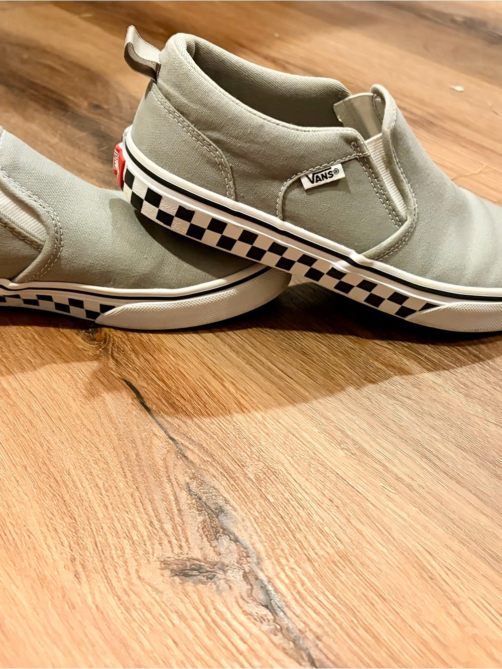 Vans gray slip-ons with checkered sidewall